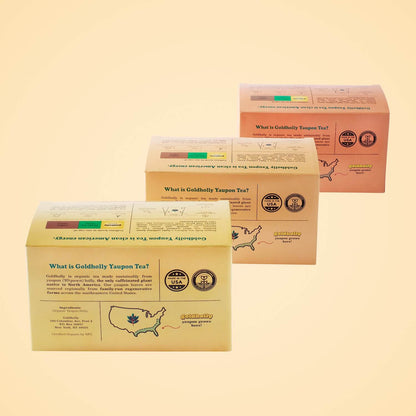 Three Goldholly bundle pack boxes displayed showing informational back panels with US maps, Made in USA and Regenerative American stamps, and brand story. Complete educational experience about America's only native caffeinated plant varieties.