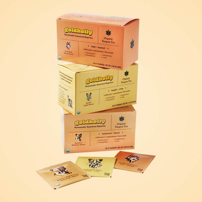 Goldholly three-roast bundle pack stacked to showcase endangered species conservation panels featuring ocelot, panther, and red wolf illustrations. Each purchase supports American wildlife while enjoying sustainable and regenerative native caffeine.