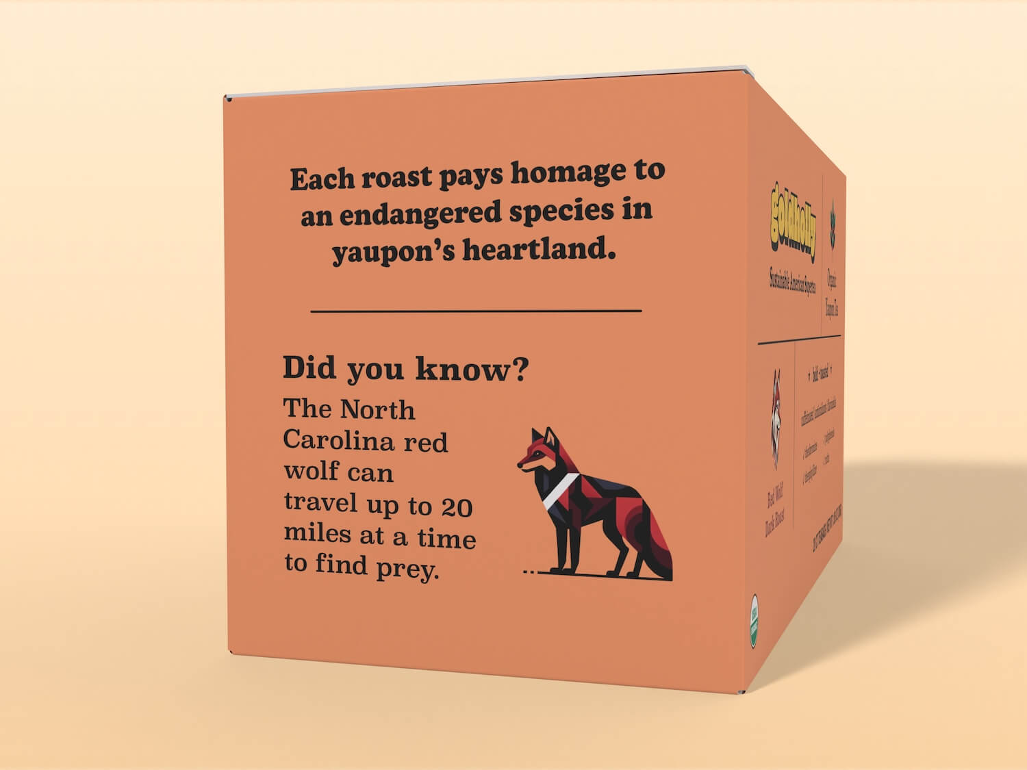 Goldholly Organic Yaupon Tea Dark Roast box packaging left panel featuring educational content about the North Carolina red wolf, explaining how the wolves travel up to 20 miles at a time to find prey. Includes a stylized geometric red wolf illustration and mentions how each roast pays homage to endangered species in yaupon's heartland, set against a yellow background.